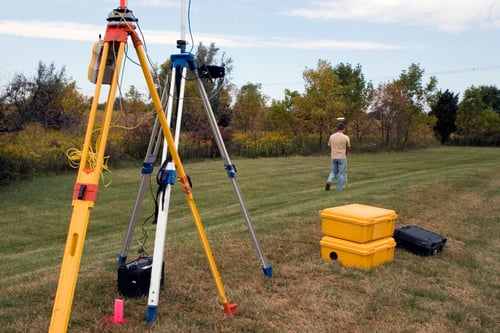 surveyor measuring land creating a plat map